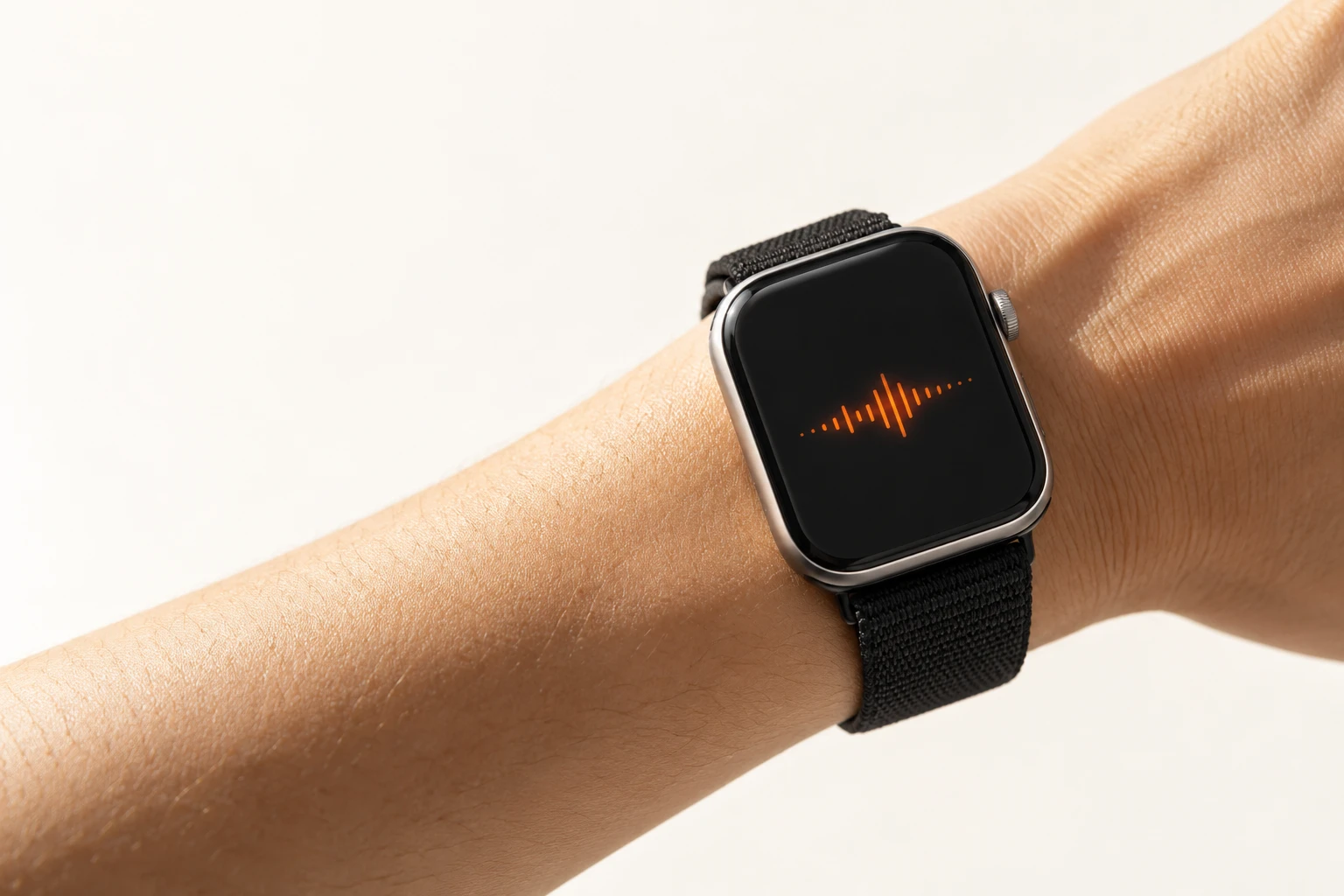Concept image of a wrist-worn smartwatch displaying an orange audio waveform